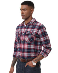Man wearing a red and blue plaid shirt on a white background