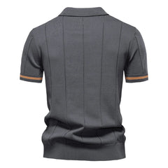 Gray polo shirt with brown trim on a white background