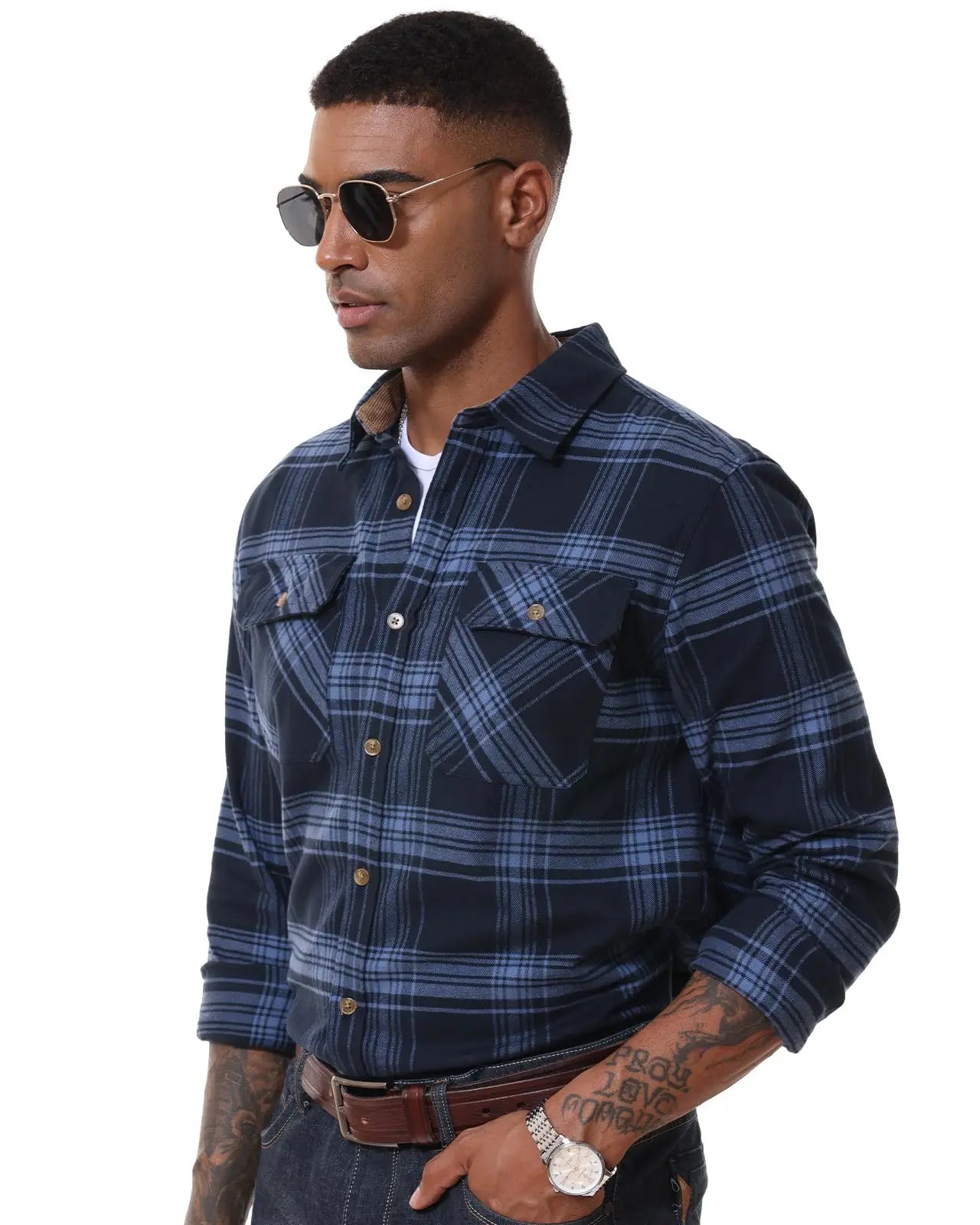 Man wearing a blue plaid shirt with sunglasses on a white background