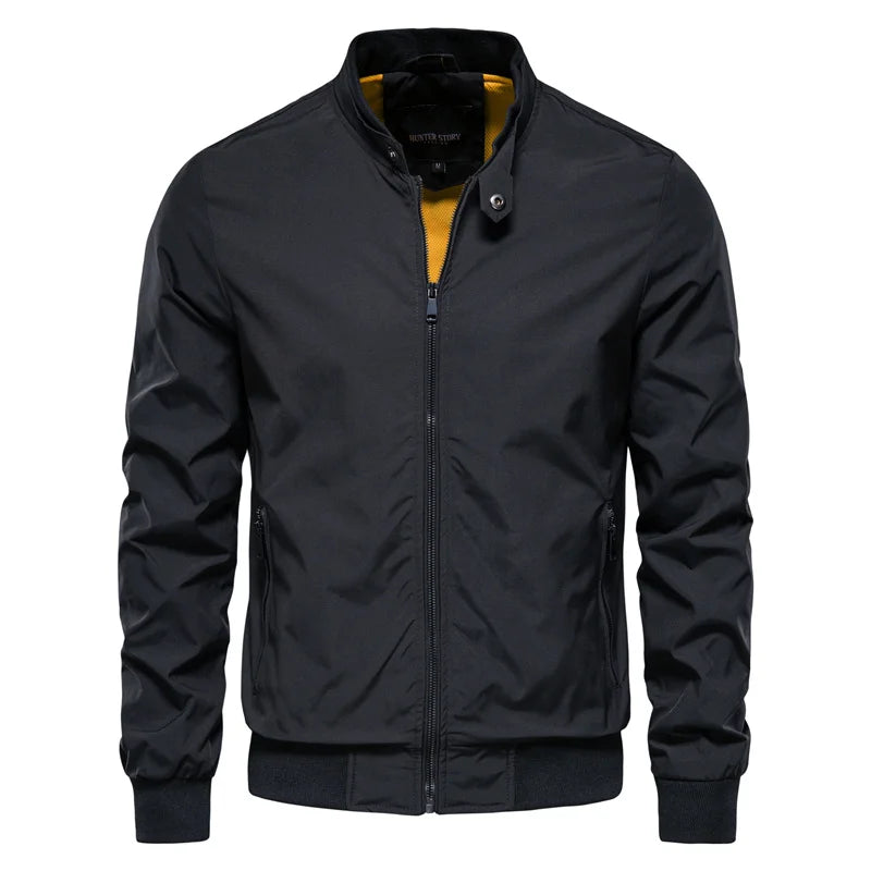 Men's winter bomber jacket in black color with a stand-up collar, zip closure, and ribbed cuffs. 