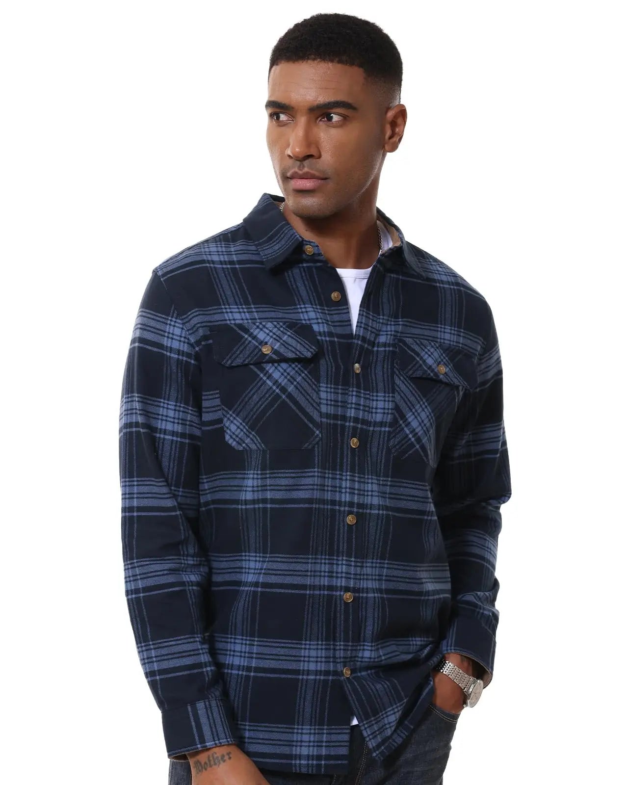 Man wearing a blue plaid shirt on a white background