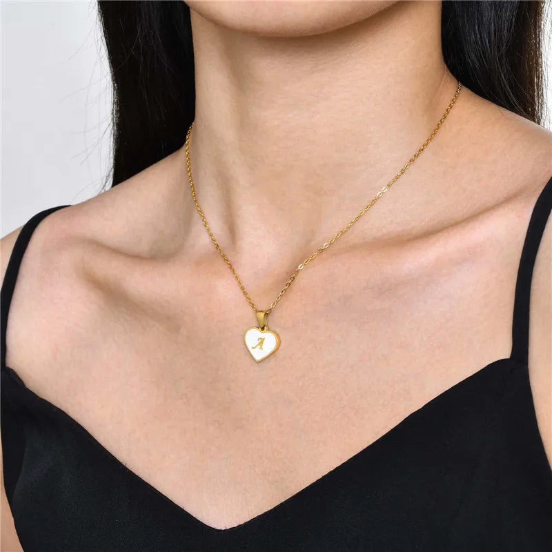 a women wearing heart shape pendant necklace 