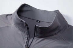 Close-up of a gray jacket with a zipper on a light gray background