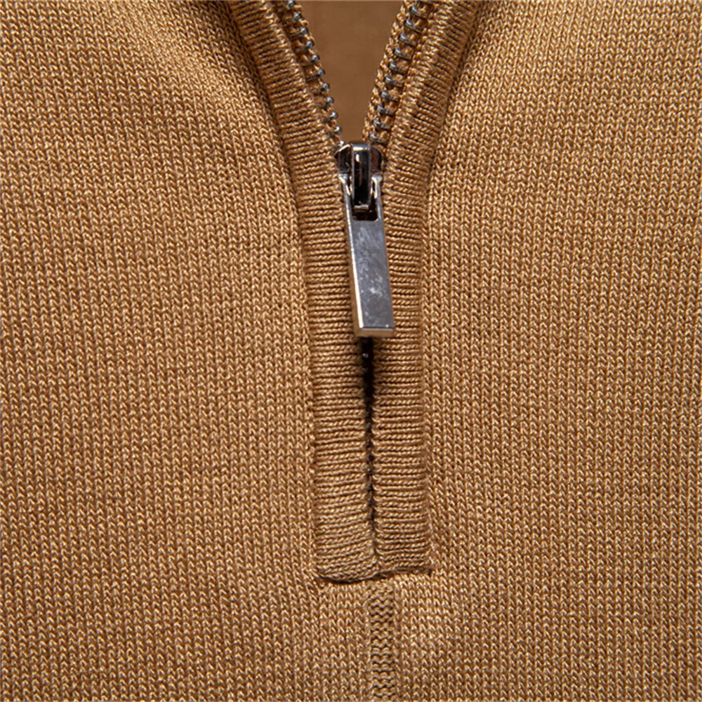 Close-up of a brown zip-up garment with a silver zipper.