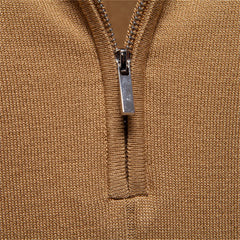 Close-up of a brown zip-up garment with a silver zipper.