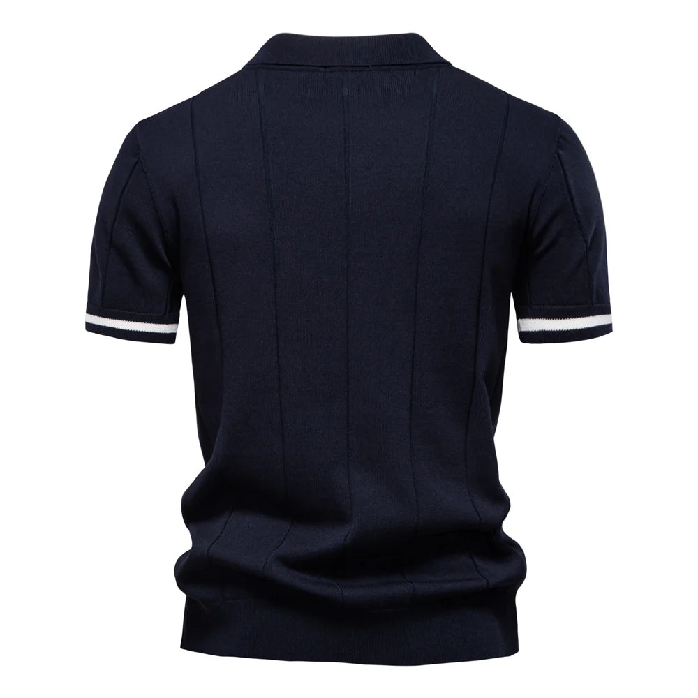 Navy blue polo shirt with white trim on a white background
