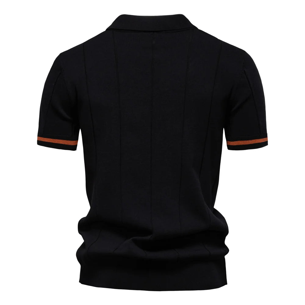 Black polo shirt with orange accents on a white background