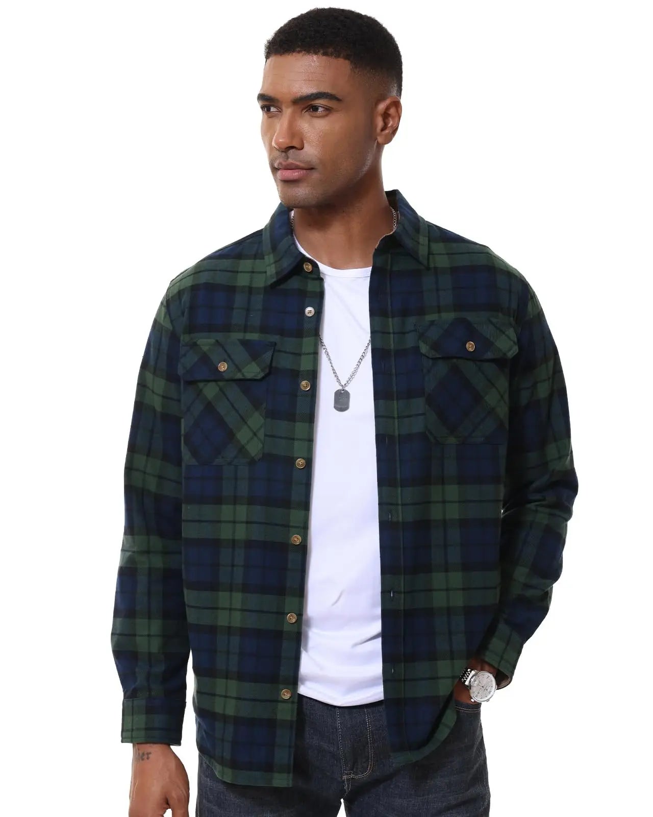 Man wearing a green and navy plaid shirt over a white t-shirt on a white background
