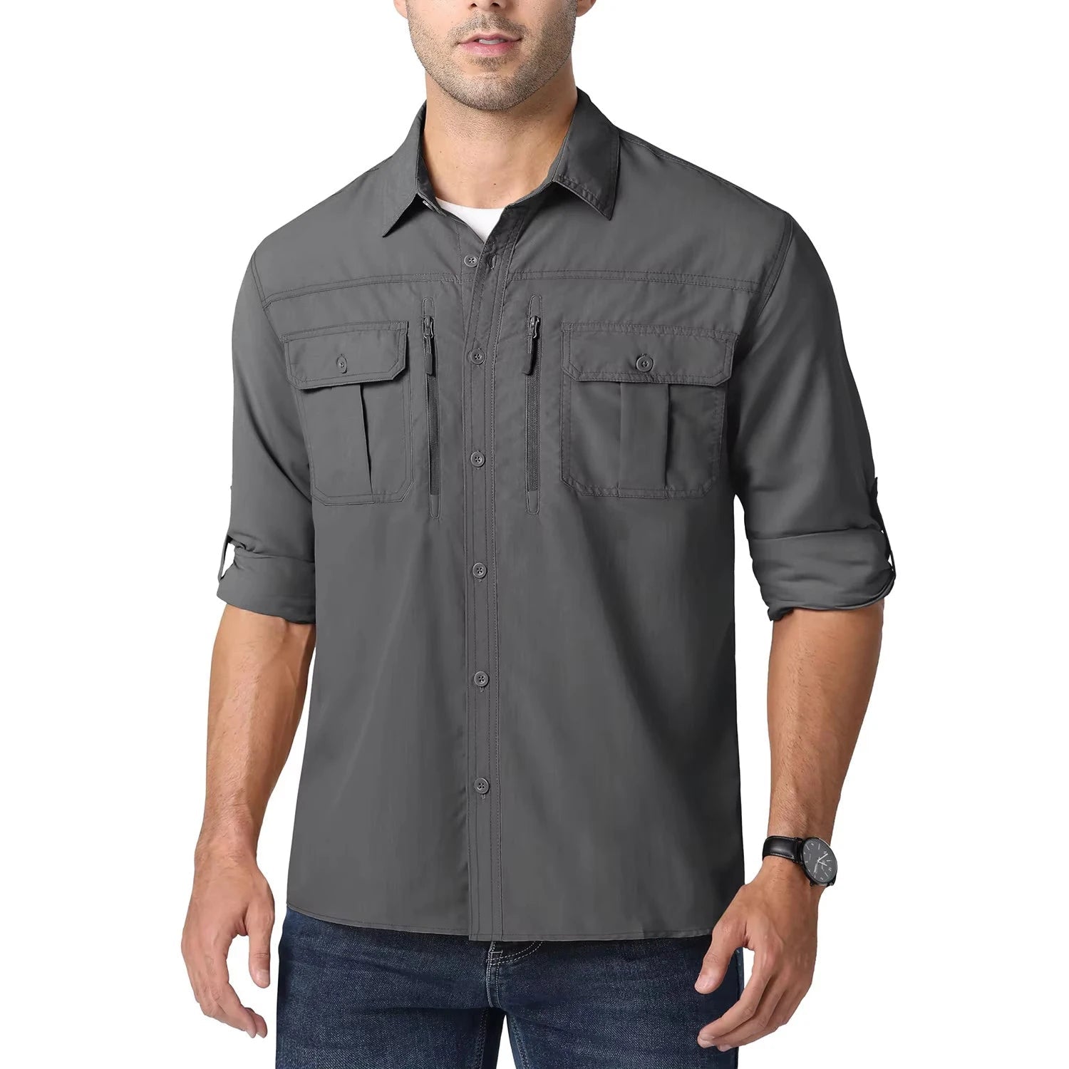 Man wearing a gray button-up shirt with rolled-up sleeves on a white background, 