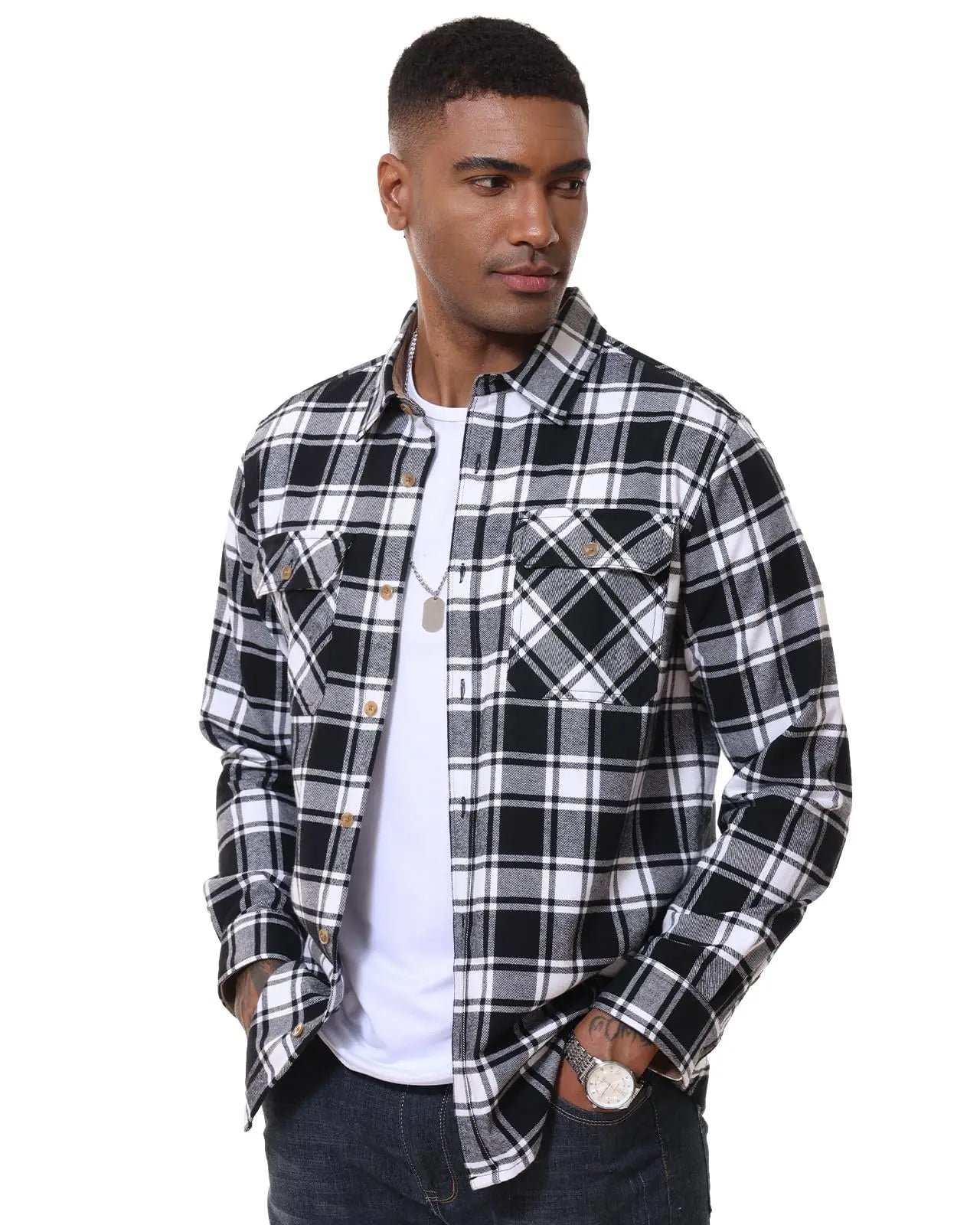 Man wearing a black and white plaid shirt over a white t-shirt on a white background