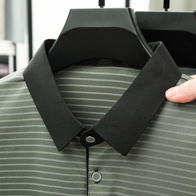 Close-up of a striped shirt with a black collar being adjusted on a hanger.